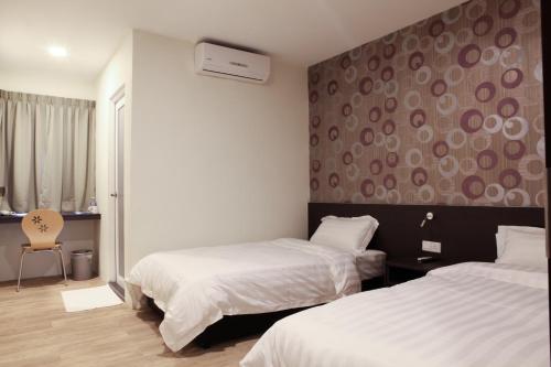 Postel nebo postele na pokoji v ubytování Hotel Mezzo