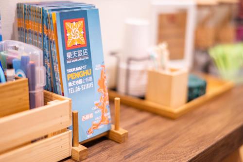 a blue box sitting on top of a wooden shelf at THEDAY B&B in Magong