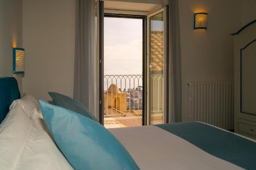 Ένα ή περισσότερα κρεβάτια σε δωμάτιο στο Ravello Dream Charming House