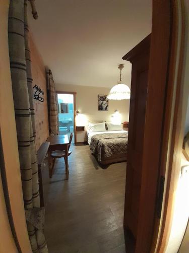 Postel nebo postele na pokoji v ubytování Hotel Astoria