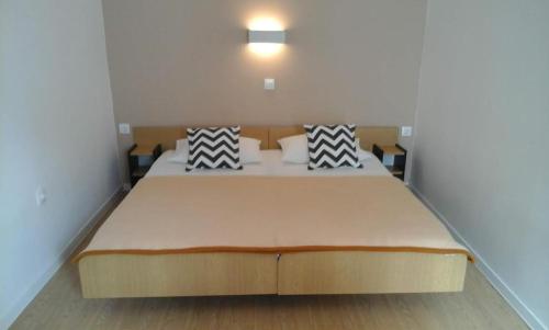 Postel nebo postele na pokoji v ubytování Apartments Kurilić