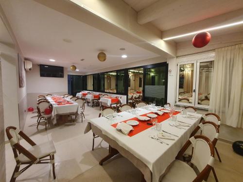 a dining room with a large table and chairs at La Lanterna in Silvi Marina