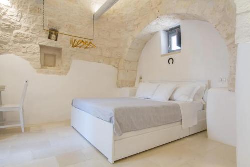Postel nebo postele na pokoji v ubytování Masseria Trulli sull'Aia