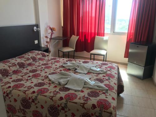 Ein Bett oder Betten in einem Zimmer der Unterkunft Terra do Mar Hotel