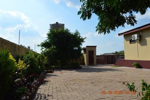a brick driveway in front of a building at Glorious Home Bed & Breakfast in Mochudi