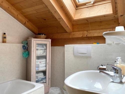 a bathroom with a sink and a medicine cabinet at Villa Angélique in Bad Kohlgrub
