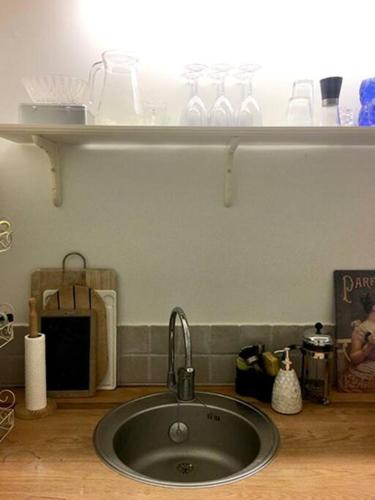 a sink in a kitchen with a light above it at Experience the Provençal dream in Taradeau