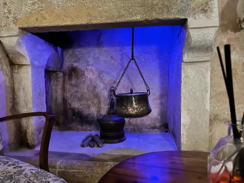a blue room with a bell on a table at B&B ME Palace in Nardò