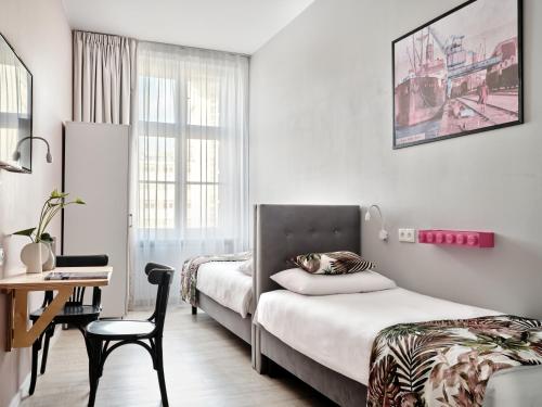 Cama o camas de una habitación en HOLA GDYNIA