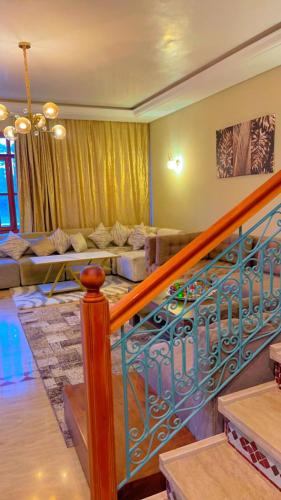 a staircase in a house with a living room at Villa Marrakech in Marrakesh
