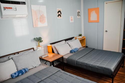Postel nebo postele na pokoji v ubytování Olive Hostel Roxas City