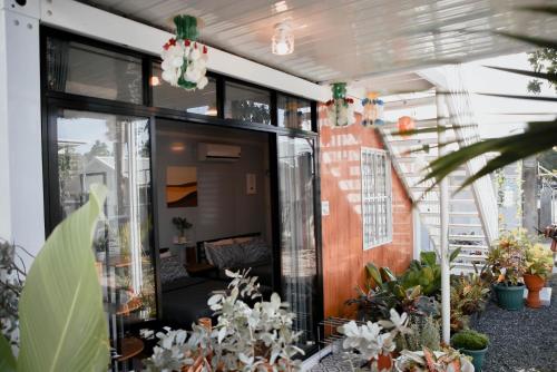 an internal view of a building with plants at Olive Hostel Roxas City in Roxas City