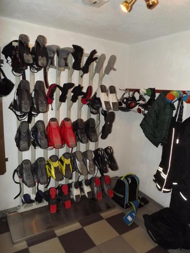 a bunch of shoes hanging on a wall at Apart Birgit in Kappl