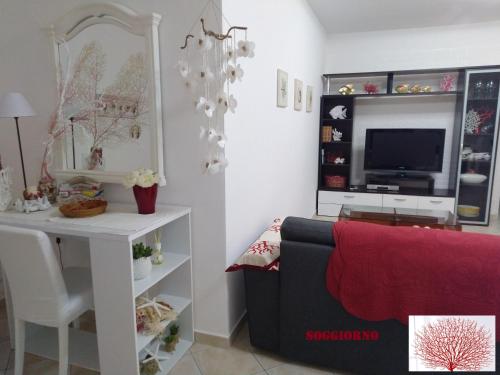 A seating area at Rami di Corallo Appartamento con Parcheggio Privato ----------