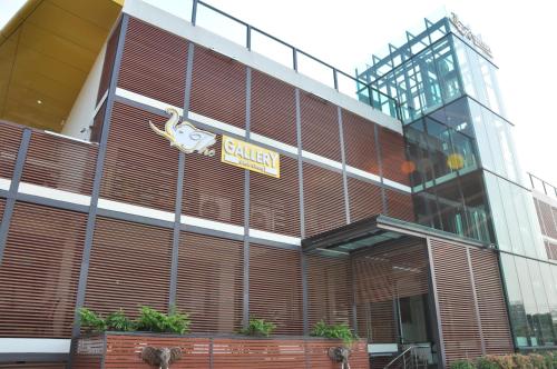 a building with a sign on the front of it at The Gallery At Koh Chang in Ko Chang