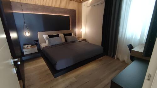 a bedroom with a large bed in a room at Apartments Tomislav in Novalja