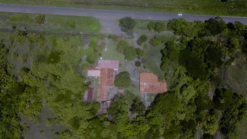 an overhead view of a building in the forest at Hotel El Cocobolo Food&Rest Room 5 B&B WiFi AC Pkg Free Swimmingpool in Liberia