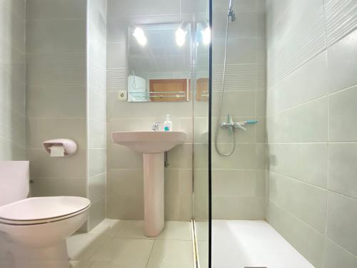 a bathroom with a shower and a toilet and a sink at Sunrise Studio Sorolla, 150 m de la playa in Miami Platja