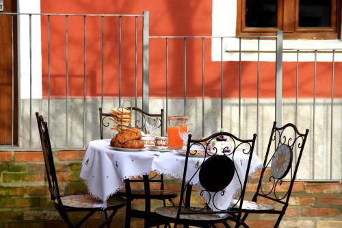 a table with a plate of food on it at Cascina Tre Botti in Agliano Terme