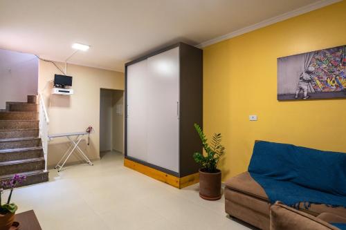 a living room with a sliding door in a room at Hostel B2B SP in Sao Paulo