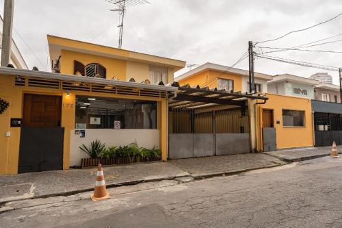 an orange traffic cone in front of a building at Hostel B2B SP in Sao Paulo