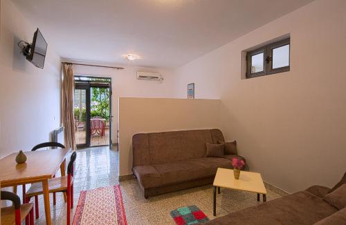 Χώρος καθιστικού στο Madra Rooms and Apartments