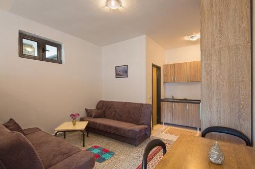 Χώρος καθιστικού στο Madra Rooms and Apartments