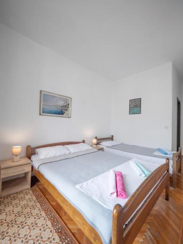 Ένα ή περισσότερα κρεβάτια σε δωμάτιο στο Madra Rooms and Apartments