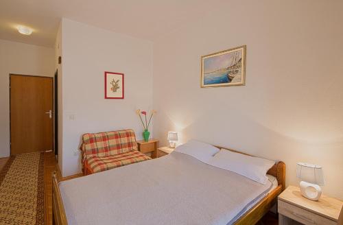 Ένα ή περισσότερα κρεβάτια σε δωμάτιο στο Madra Rooms and Apartments