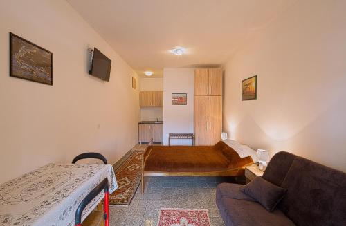 Ένα ή περισσότερα κρεβάτια σε δωμάτιο στο Madra Rooms and Apartments