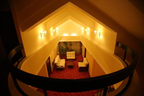 an overhead view of a living room with a staircase at Hotel Mara in Baia Mare
