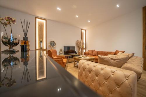 a living room with a couch and a table at Apartments Nikčević in Kotor
