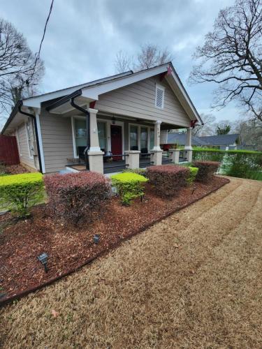 a house with a driveway in front of it at Spacious Newly Renovated Home in Atlanta