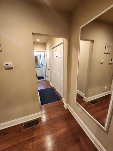 a hallway of a home with a large mirror at Spacious Newly Renovated Home in Atlanta