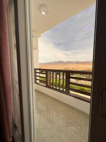 a view from a door of a balcony with a view at Jasmine Resort & Aqua park in Sharm El Sheikh