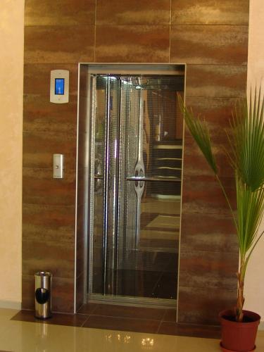 a shower with a glass door in a bathroom at Hotel Iris in Nesebar