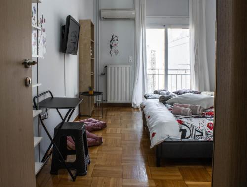 Posteľ alebo postele v izbe v ubytovaní Acropolis Urban Flat