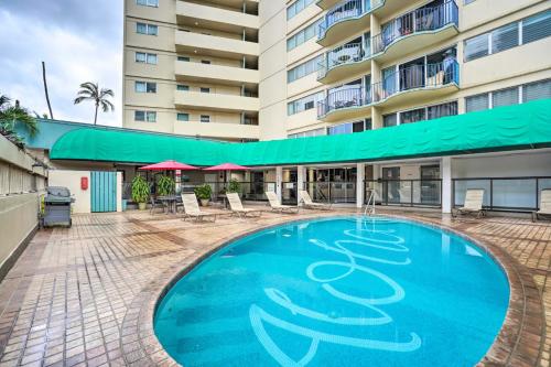 a large swimming pool in front of a building at Waikiki 2-bedroom Sweet Home in Honolulu