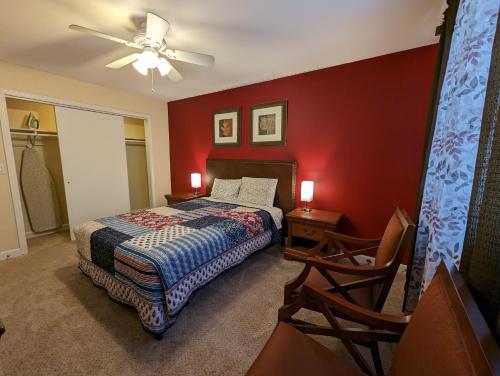 a bedroom with a bed and a ceiling fan at LAKE GEORGE FAMILY VACATION HOME in Lake George