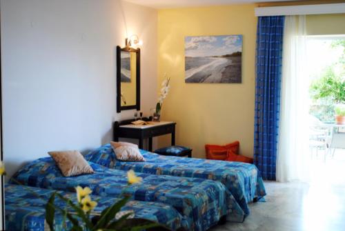 Ένα ή περισσότερα κρεβάτια σε δωμάτιο στο Marita's Apartments