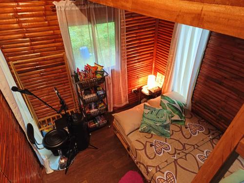 a living room with a couch and a window at SMALL CABIN IN THE SOUTH 