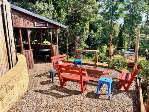 a playground with benches and a table and a bar at House of Mahalo Accommodation in Mapleton