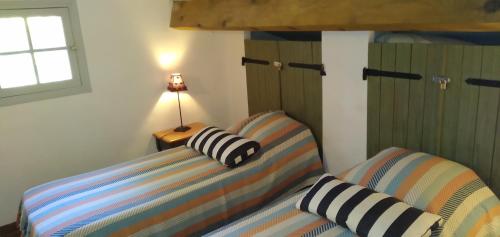 Ein Bett oder Betten in einem Zimmer der Unterkunft Domaine L'Helion