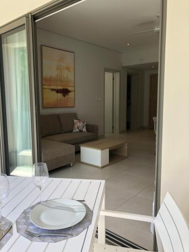 Zona de estar de Montecrista Appart moderne et cosy, 1 chambre à 2 min plage Pereybere