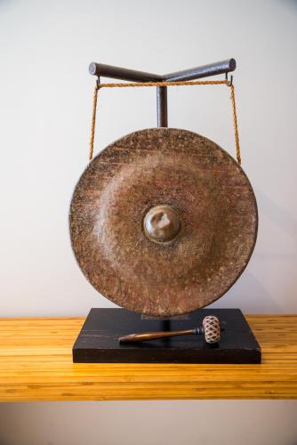 a close up of a gong on a table at Rysara Hotel in Dakar