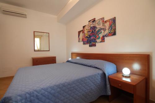Säng eller sängar i ett rum på Venere ed Enea - Appartamenti Vista Mare