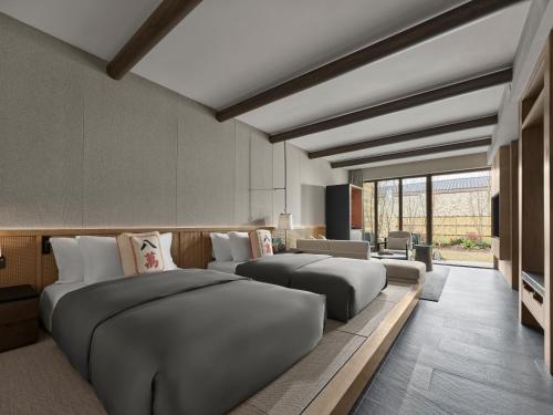 Ένα ή περισσότερα κρεβάτια σε δωμάτιο στο Angsana Chengdu Wenjiang
