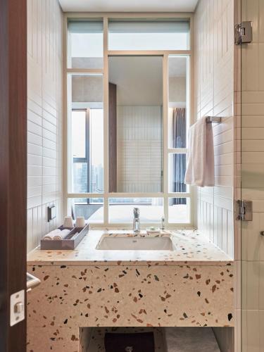 a bathroom with a sink and a mirror at HOTEL in 9 Gangnam in Seoul