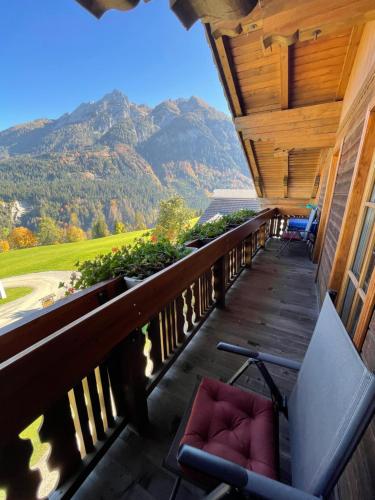 a porch with chairs and a view of a mountain at Haus Stabentheiner in Birnbaum