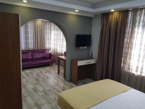 Postel nebo postele na pokoji v ubytování EYFEL HOTEL